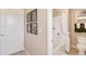 This bathroom features a full bath with white shower curtain and modern art on the wall at 3418 Belleville Ridge Rd, Elizabeth, CO 80107