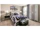 bedroom features an airplane-themed wall art, modern furniture, and an accent locker at 3418 Belleville Ridge Rd, Elizabeth, CO 80107