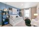 This bedroom features a daybed, desk, and unique wall decor for a personalized touch at 3418 Belleville Ridge Rd, Elizabeth, CO 80107