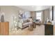 Stylish living room with modern furniture, neutral tones, decorative lighting, and eye-catching artwork on the walls at 3418 Belleville Ridge Rd, Elizabeth, CO 80107