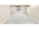 Unfinished basement space with neutral carpet, and bright, above ground windows for natural light at 10774 W 107Th Cir, Broomfield, CO 80021