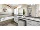 Bright bathroom with double vanity, soaking tub, and modern finishes offers a spa-like retreat at 10774 W 107Th Cir, Broomfield, CO 80021