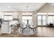 Bright dining area with a round table, seating for five, and access to the patio at 10774 W 107Th Cir, Broomfield, CO 80021