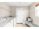 Bright and functional laundry room features modern appliances and ample storage at 10774 W 107Th Cir, Broomfield, CO 80021