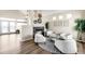 Bright living room featuring a modern fireplace, neutral tones, and a cozy seating area at 10774 W 107Th Cir, Broomfield, CO 80021