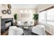 Bright living room featuring a modern fireplace, neutral tones, and a cozy seating area at 10774 W 107Th Cir, Broomfield, CO 80021