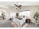 Comfortable bedroom with a ceiling fan, a large window, and neutral decor at 10774 W 107Th Cir, Broomfield, CO 80021