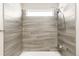 Tiled shower enclosure featuring a rainfall shower head and tiled walls at 10774 W 107Th Cir, Broomfield, CO 80021