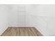 A blank walk-in closet is ready for a homeowner's customizations to fit their personal style and needs at 10774 W 107Th Cir, Broomfield, CO 80021