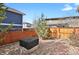 Landscaped backyard featuring a covered fire pit and rock garden, creating a serene outdoor space at 9268 E 37Th Ave, Denver, CO 80238