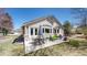 Charming backyard with a covered patio, outdoor seating, and mature trees, perfect for entertaining and relaxation at 9559 Brook Hill Ln, Lone Tree, CO 80124