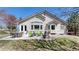 Serene backyard with a spacious patio, inviting seating, and lush landscaping, creating a perfect outdoor retreat at 9559 Brook Hill Ln, Lone Tree, CO 80124