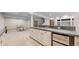 The basement features an open living area with a kitchenette, dining area, and a staircase at 9559 Brook Hill Ln, Lone Tree, CO 80124
