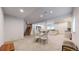 Spacious basement featuring an open floor plan, dining area, bar, and staircase to the upper level at 9559 Brook Hill Ln, Lone Tree, CO 80124