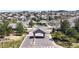 Elegant community entrance featuring a gated entry, stone pillars, and meticulous landscaping, creating a welcoming atmosphere at 9559 Brook Hill Ln, Lone Tree, CO 80124