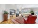 Bright living room features a fireplace, built-in shelves, and hardwood flooring at 9559 Brook Hill Ln, Lone Tree, CO 80124