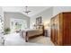 This spacious main bedroom features a large bay window for natural light and a beautiful wardrobe at 9559 Brook Hill Ln, Lone Tree, CO 80124