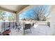 Relax on this cozy patio with beautiful views and comfortable seating, perfect for enjoying the outdoors at 9559 Brook Hill Ln, Lone Tree, CO 80124