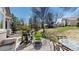 This inviting patio is an ideal space for outdoor relaxation, featuring comfortable seating and a serene backyard view at 9559 Brook Hill Ln, Lone Tree, CO 80124