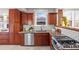 Bright kitchen with stainless steel appliances, subway tile backsplash, and ample cabinet storage at 2620 Bellaire St, Denver, CO 80207