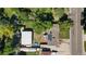 Aerial view of property with a home, large garage, deck, and solar panels on the roof at 8178 W 64Th Ave, Arvada, CO 80004