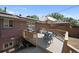 Elevated backyard deck featuring a patio table and chairs perfect for outdoor entertaining at 8178 W 64Th Ave, Arvada, CO 80004