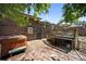 Spacious backyard featuring a hot tub, a brick home, a wooden deck and a stone patio at 8178 W 64Th Ave, Arvada, CO 80004