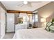 Comfortable bedroom with a sliding barn door leading to the en suite bathroom at 7877 S University Way, Centennial, CO 80122