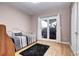 Cozy bedroom with bright light and a view of sliding glass doors, offering a serene and relaxing retreat at 7877 S University Way, Centennial, CO 80122