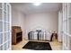 Cozy bedroom with bright light and a view of french doors, offering a serene and relaxing retreat at 7877 S University Way, Centennial, CO 80122
