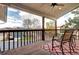 Covered deck with ceiling fan, outdoor seating, and view of the neighborhood at 7877 S University Way, Centennial, CO 80122