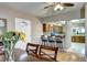 Inviting dining room with hardwood floors offering views to kitchen bar with stainless steel appliances at 7877 S University Way, Centennial, CO 80122