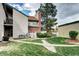 Exterior view of a home with a well-maintained lawn and landscaped garden at 7877 S University Way, Centennial, CO 80122