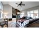 Cozy living room features a stone fireplace, built-in shelving, plush seating, and great natural light at 7877 S University Way, Centennial, CO 80122