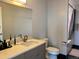Modern bathroom featuring a marble countertop, toilet, and walk-in shower with black-tiled flooring at 2718 Pine St # 305, Boulder, CO 80302