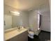 Modern bathroom featuring a single sink vanity with stone countertop and a shower-tub with dark tile floor at 2718 Pine St # 305, Boulder, CO 80302