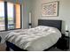Bright bedroom featuring contemporary decor, a large window, and comfortable sleeping arrangements at 2718 Pine St # 305, Boulder, CO 80302