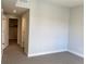 A bright bedroom featuring neutral carpet with a view into a walk-in closet at 2718 Pine St # 305, Boulder, CO 80302