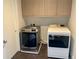 Convenient laundry room equipped with modern washer and dryer units and storage cabinets at 2718 Pine St # 305, Boulder, CO 80302
