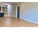 Spacious, light-filled room with modern kitchen, wood floors, and a minimalist aesthetic at 2718 Pine St # 305, Boulder, CO 80302