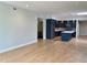 Bright, open living area with modern kitchen featuring dark cabinets and island, perfect for entertaining at 2718 Pine St # 305, Boulder, CO 80302