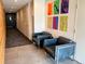 Lobby sitting area with leather chairs and colorful modern wall art at 2718 Pine St # 305, Boulder, CO 80302