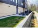 Cozy outdoor patio with adirondack chairs and green grass at 2718 Pine St # 305, Boulder, CO 80302