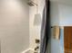 Updated shower features contemporary tilework, modern fixtures, and neutral towels at 2718 Pine St # 305, Boulder, CO 80302