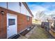 Exterior showing access door to backyard with partial fence at 9241 Knox Ct, Westminster, CO 80031