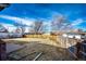 Large, fenced backyard with a small stone fountain, offering privacy and space for outdoor activities at 9241 Knox Ct, Westminster, CO 80031