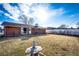 Well-maintained backyard featuring a brick home exterior and a tranquil stone lantern at 9241 Knox Ct, Westminster, CO 80031