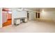 Large basement area with carpeting, a desk, and neutral walls, providing ample space at 9241 Knox Ct, Westminster, CO 80031