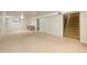 A finished basement with carpeting, with stairs leading to the main floor on the right side at 9241 Knox Ct, Westminster, CO 80031