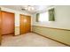 A bedroom features neutral carpet, a ceiling fan, and a closet at 9241 Knox Ct, Westminster, CO 80031